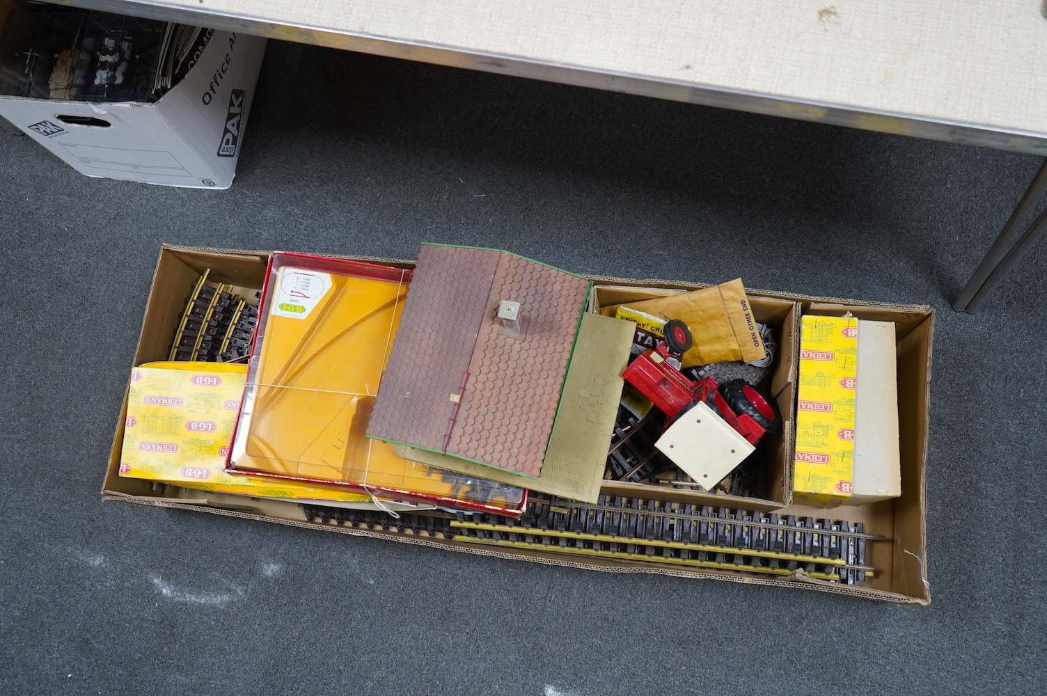 A quantity of Lehmann LGB G scale railway rolling stock, track and accessories, including; a bogie carriage, fourteen freight wagons, four trackside buildings, signals, boxed sets of points, a good selection of unboxed t